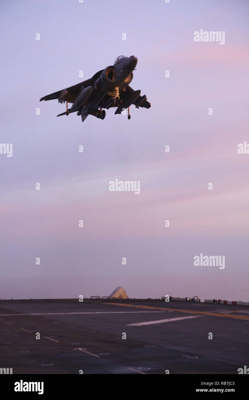 MEDITERRANEAN SEA (Dec. 5, 2016) An AV-8B Harrier II with 22nd Marine Expeditionary Unit (MEU) lands on the flight deck of the amphibious assault ship USS Wasp (LHD-1), Dec. 5, 2016. The 22nd MEU, deployed with the Wasp Amphibious Ready Group, is conducting precision air strikes in support of the Libyan Government aligned forces against Daesh targets in Sirte, Libya, as part of Operation Odyssey Lightning. Stock Photo