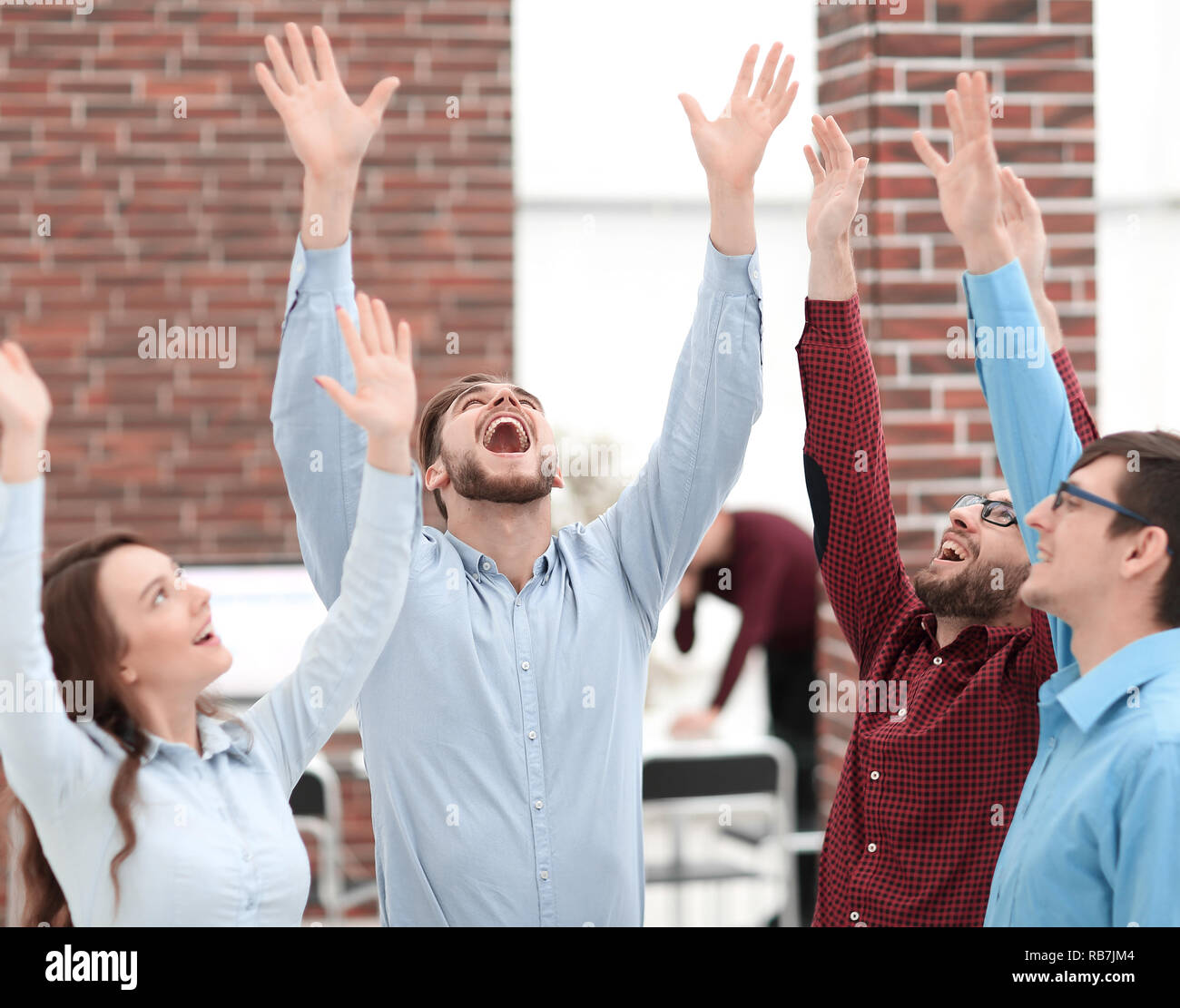 Happy smiling business team in office Stock Photo - Alamy