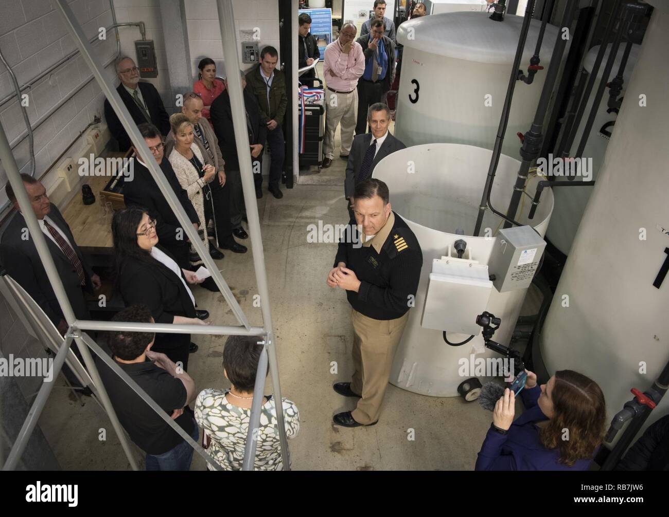 Naval Surface Warfare Center Carderock Division Carderock Division Commanding Officer Capt. Mark Vandroff addresses employees along with Technical Director Dr. Tim Arcano, during the official opening of the new Ballast Water Research Lab in West Bethesda, Md., Dec. 5, 2016. Stock Photo