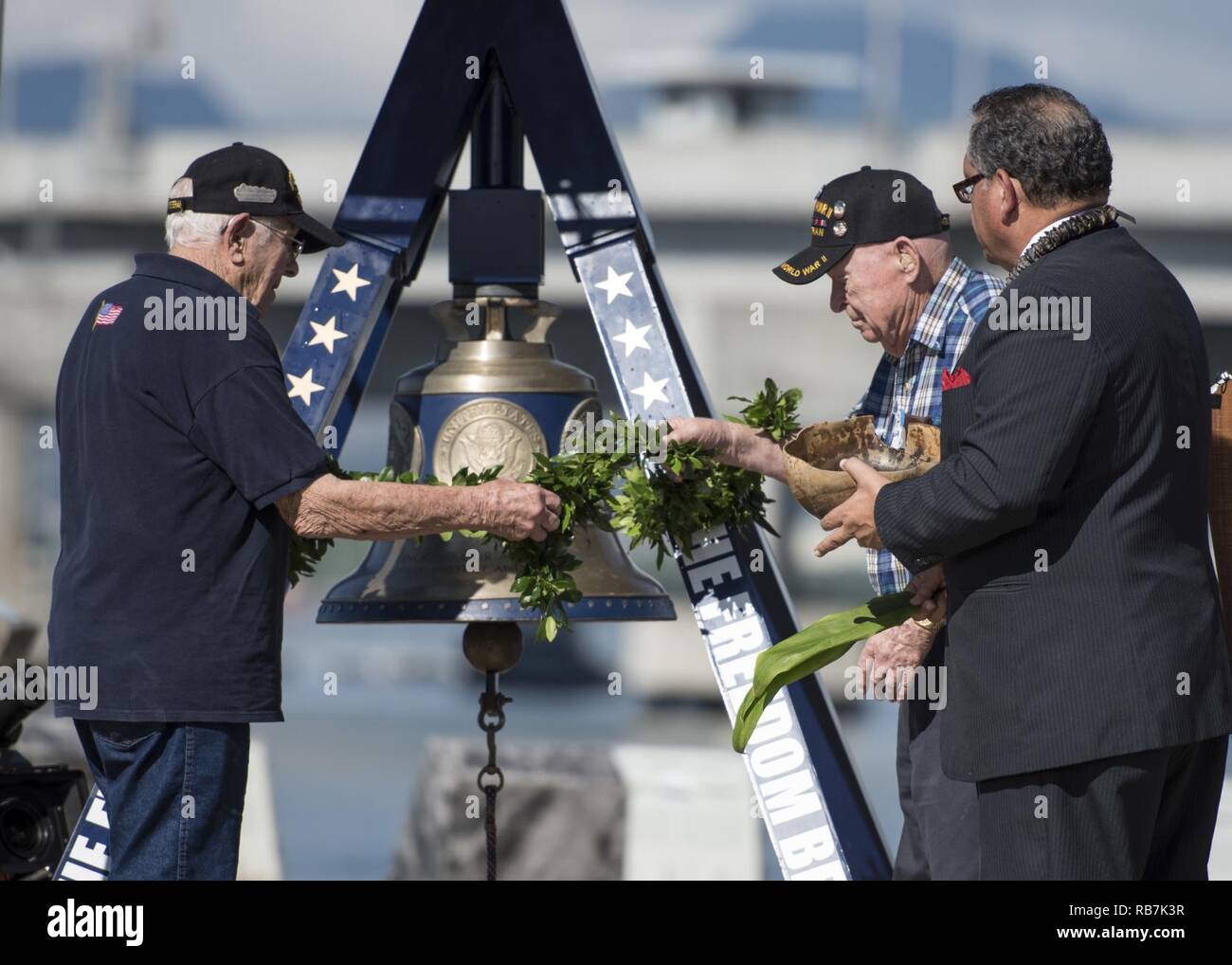 PEARL HARBOR (Dec. 6, 2016) Kahu Kelekona Bishaw, right, and World War II veterans perform a blessing during an America's Freedom Bell ringing ceremony at the USS Bowfin Submarine Museum and Park. Dec. 7, 2016, marks the 75th anniversary of the attacks on Pearl Harbor and Oahu. The U.S. military and the State of Hawaii are hosting a series of remembrance events throughout the week to honor the courage and sacrifices of those who served Dec. 7, 1941, and throughout the Pacific theater. As a Pacific nation, the U.S. is committed to continue its responsibility of protecting the Pacific sea-lanes, Stock Photo
