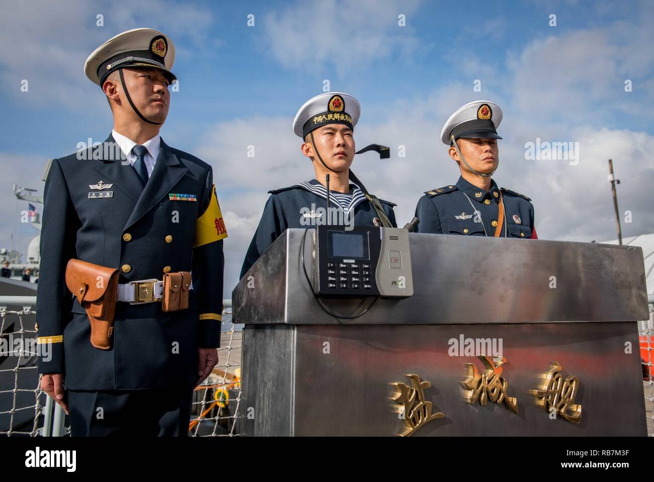 SAN DIEGO (Dec. 6, 2016) Chinese sailors stand a quarter deck watch on the deck of the Jiangkai II-class frigate Yancheng (FFG 546) after arriving in San Diego. Rear Adm. Jay Bynum, commander of Carrier Strike Group Nine, is hosting three People’s Liberation Army (Navy) ships during a routine port visit in San Diego. Stock Photo