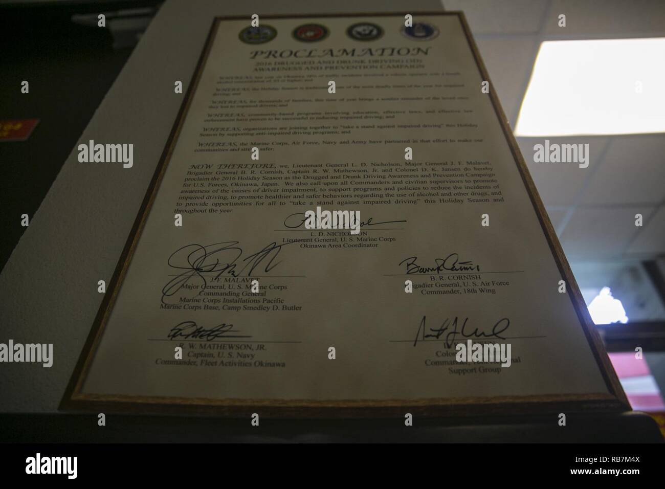 The signed 2016 Drugged and Drunk Driving Proclamation hangs in the Marine Corps Installation headquarters building Pacific Dec 6 aboard Camp Foster, Okinawa, Japan. The proclamation signifies the start of a safety and awareness program designed to reduce the number of alcohol and drug-related automobile incidents on Okinawa. According to Lt. Gen. Larry Nicholson, the Okinawa Area Coordinator, although the number of drugged and drunk driving incidents is down from last year, it is important that safety and responsibility continue to be instilled in all service members. Stock Photo