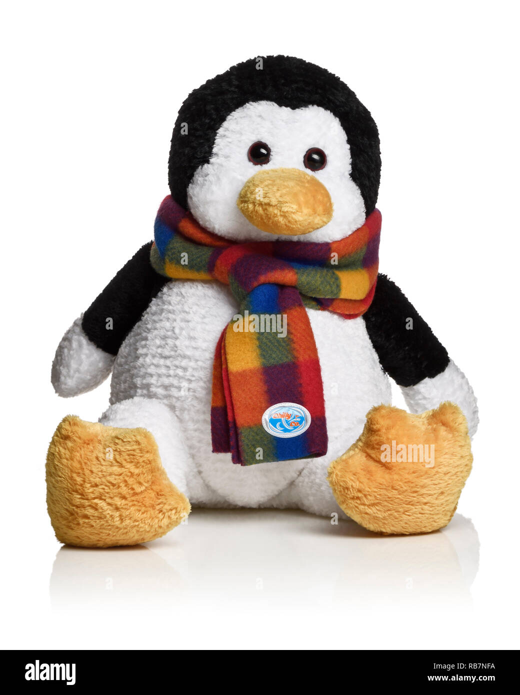 Cuddly penguin toy wearing a scarf Stock Photo