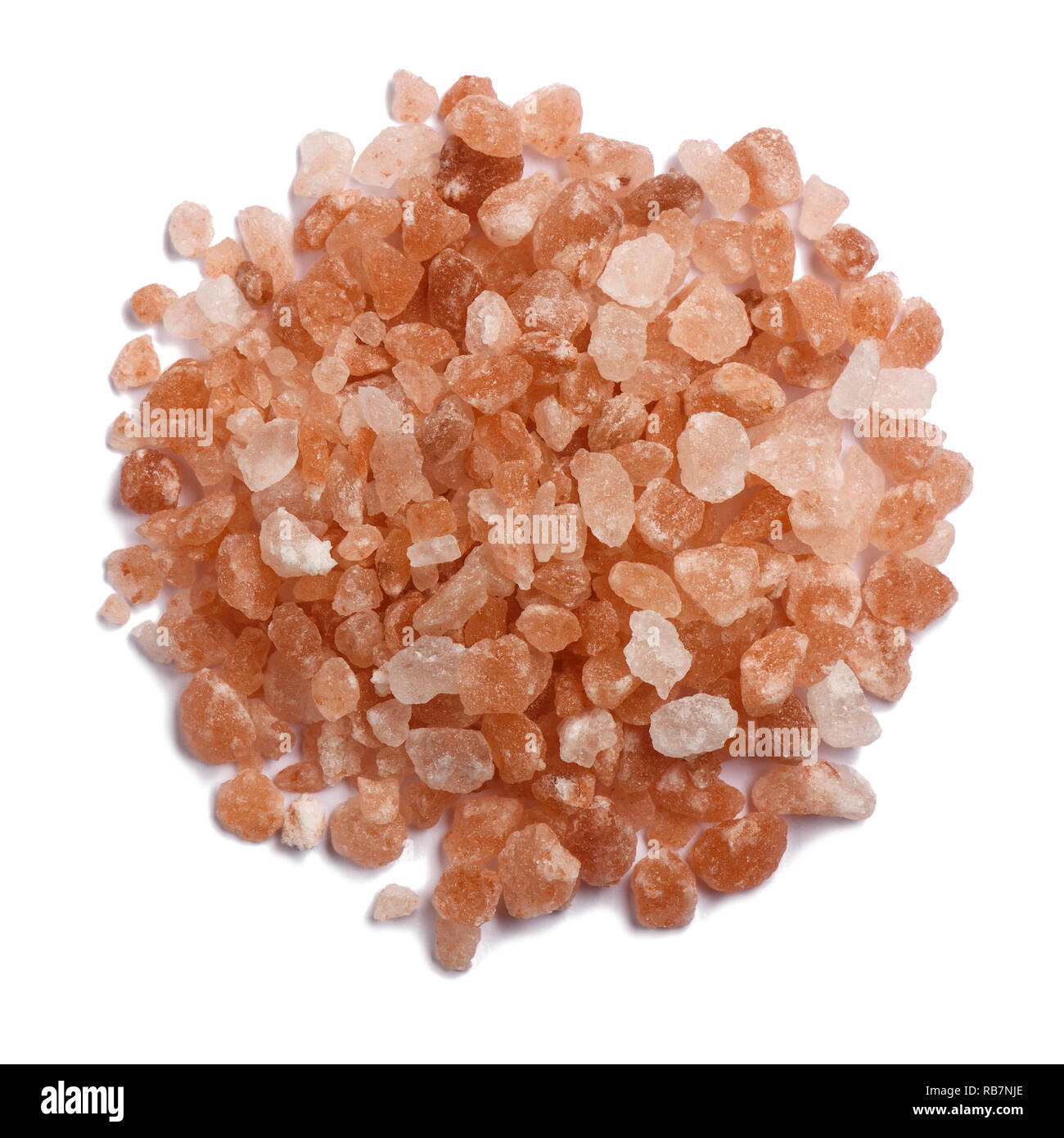 A small pile of Himalayan pink salt granules Stock Photo