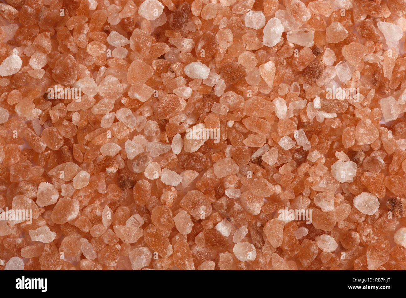 Himalayan pink salt granules Stock Photo