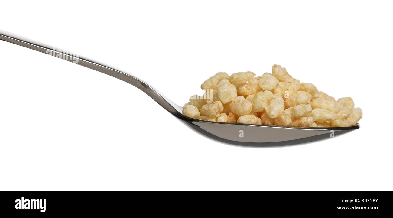 A metal spoon filled with Kellogg's Ricicles breakfast cereal Stock Photo