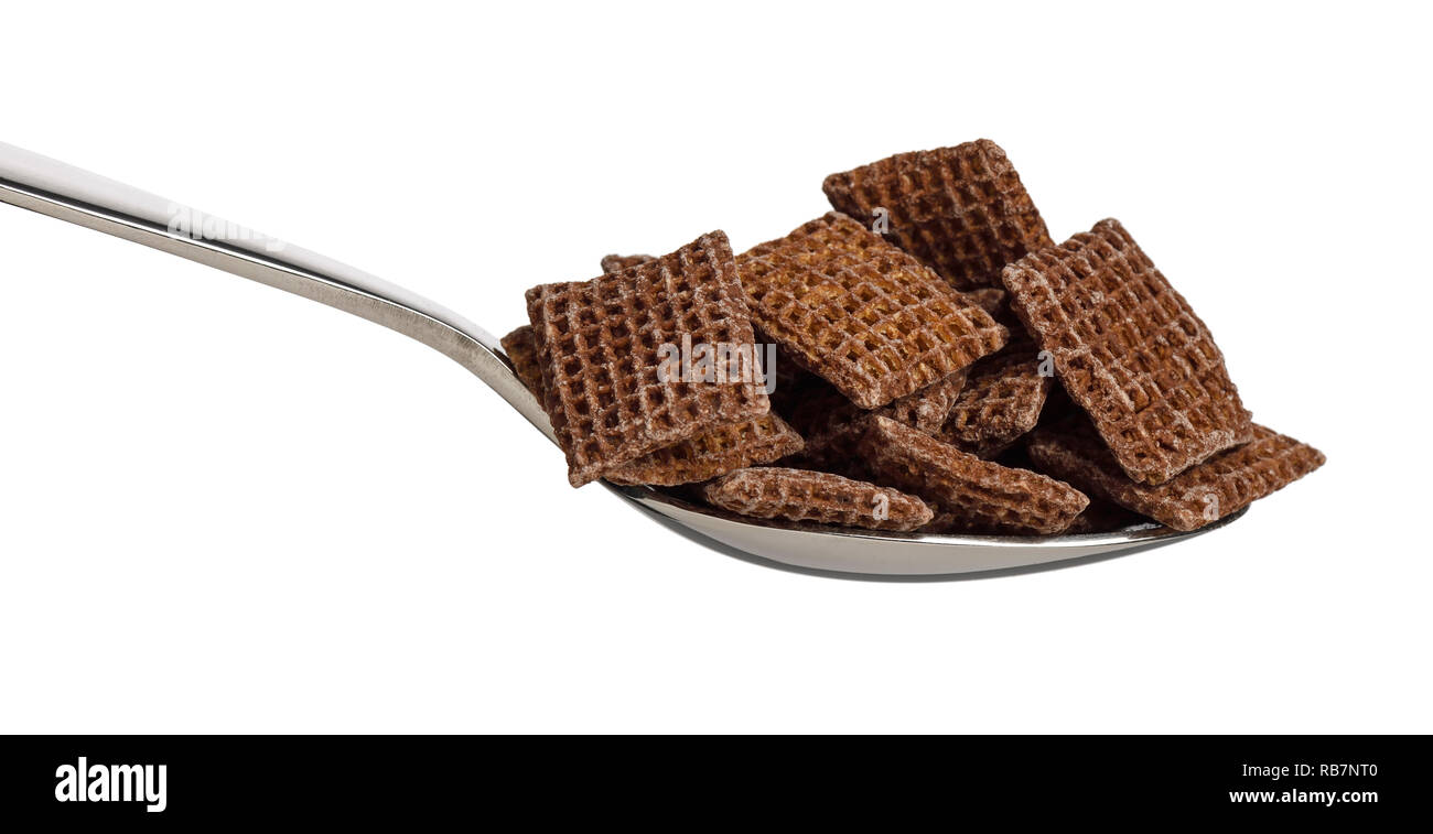 A metal spoon filled with Nestle Coco Shreddies breakfast cereal Stock Photo