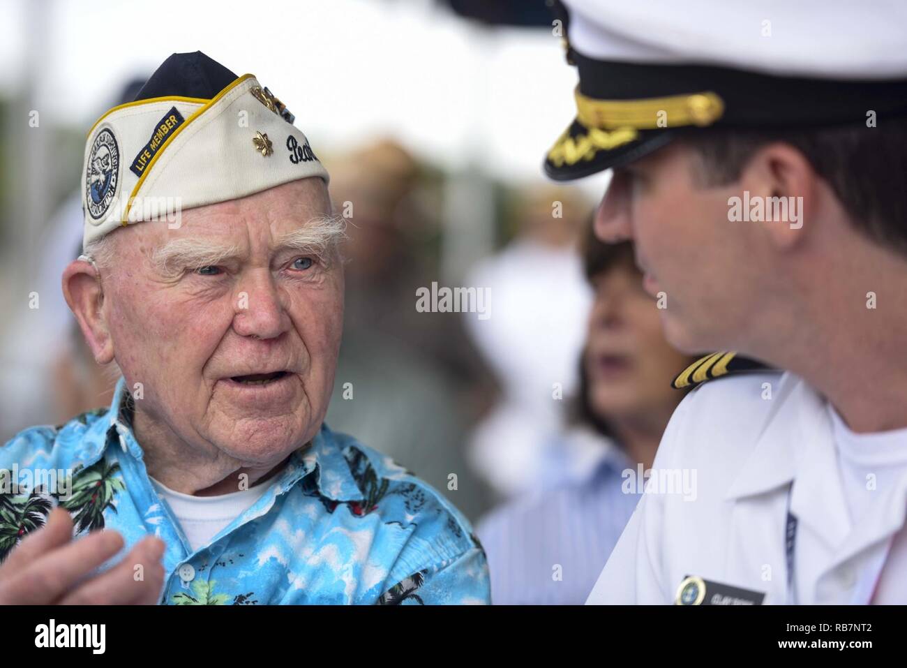 PEARL HARBOR (Dec. 7, 2016) USS Oklahoma survivor Roy Carter and Cmdr. Clayton Doss, assigned to U.S. Pacific Fleet, converse before the USS Oklahoma Memorial Service on the 75th anniversary of the attacks on Pearl Harbor and Oahu. The U.S. military and the State of Hawaii are hosting a series of remembrance events throughout the week to honor the courage and sacrifices of those who served during Dec. 7, 1941, and throughout the Pacific theater. As a Pacific nation, the U.S. is committed to continue its responsibility of protecting the Pacific sea-lanes, advancing international ideals and rela Stock Photo