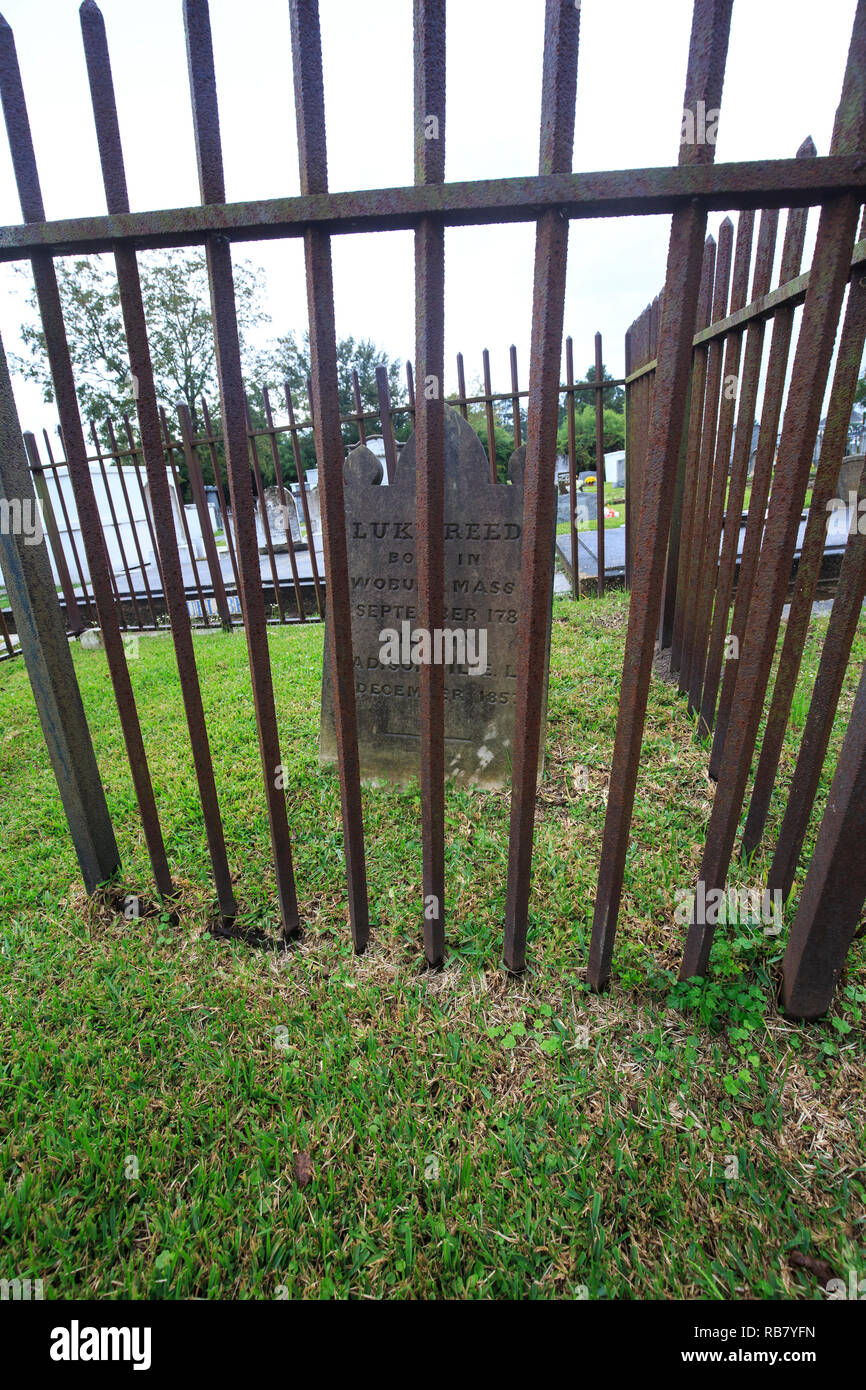 Wrought-iron fence surrounding a grave plot in a cemetery in Madisonville, Alabama. Stock Photo