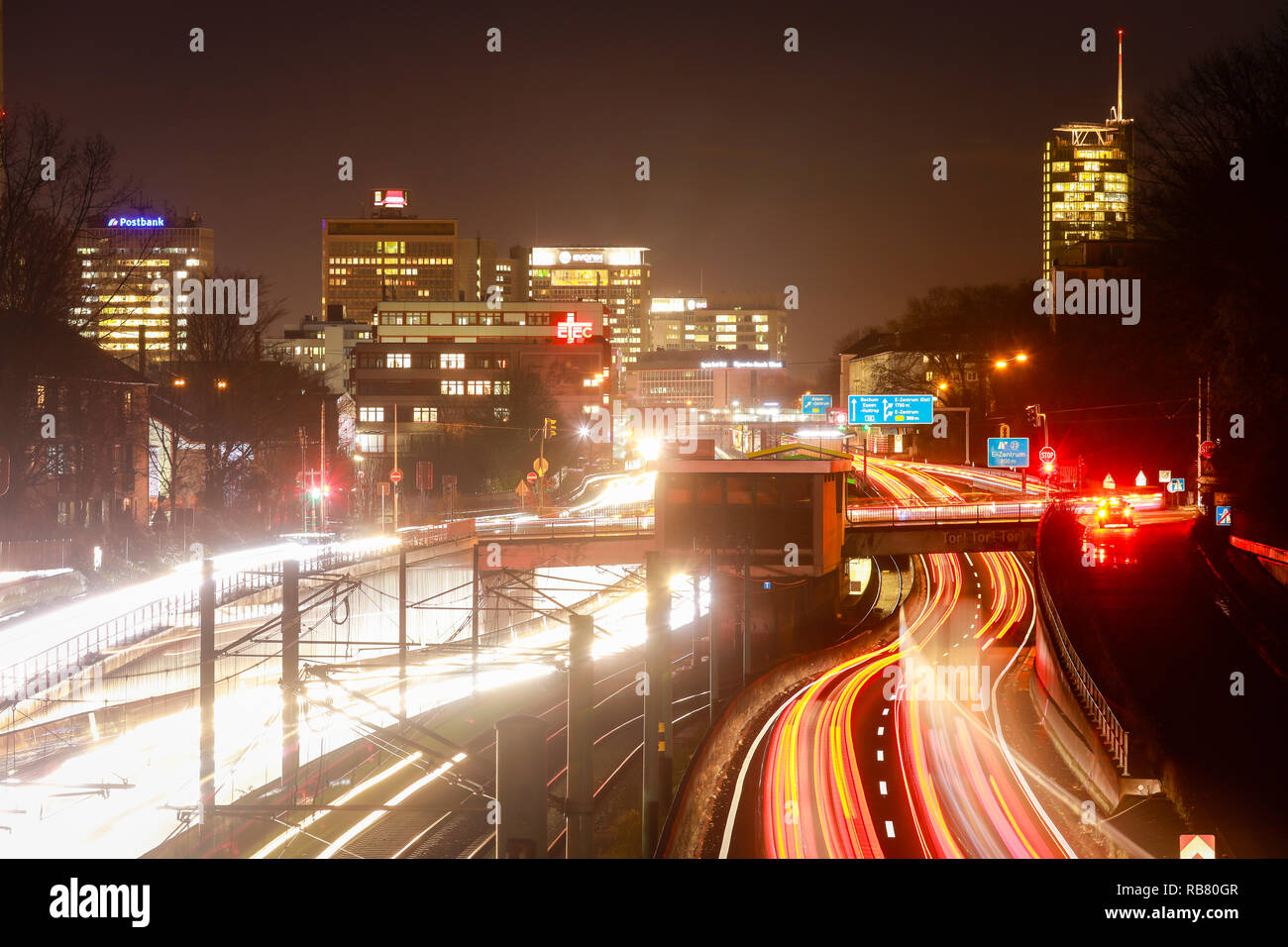 Essen, North Rhine-Westphalia, Ruhr area, Germany - Blue environmental zone, motorway A40 at the end of workday traffic with a view towards the city c Stock Photo