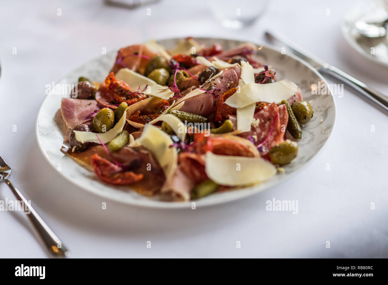Spanish ham, sun dried tomato, olive and cheese sald Stock Photo