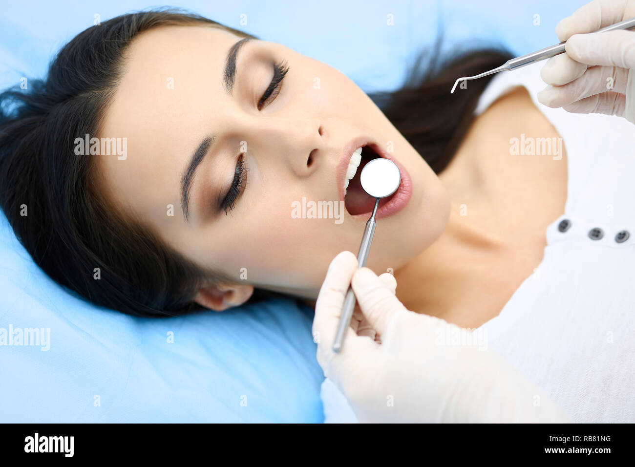 Young female patient visiting dentist office.Beautiful woman with ...