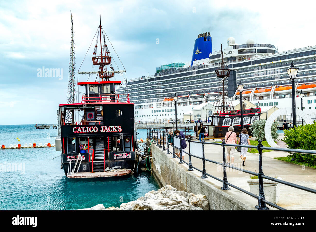 Calico Jack's floating bar moored up in Hamilton, Burmuda with P&O Arcadia in the background. Stock Photo
