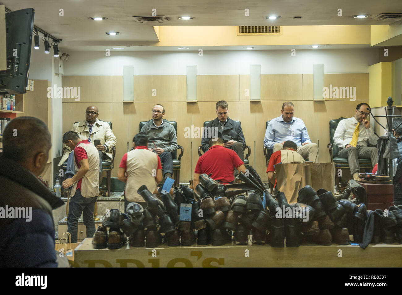 Shoeshine shop in the underground shopping concourse at Rockefeller Center in midtown Manhattan, New York City. Stock Photo