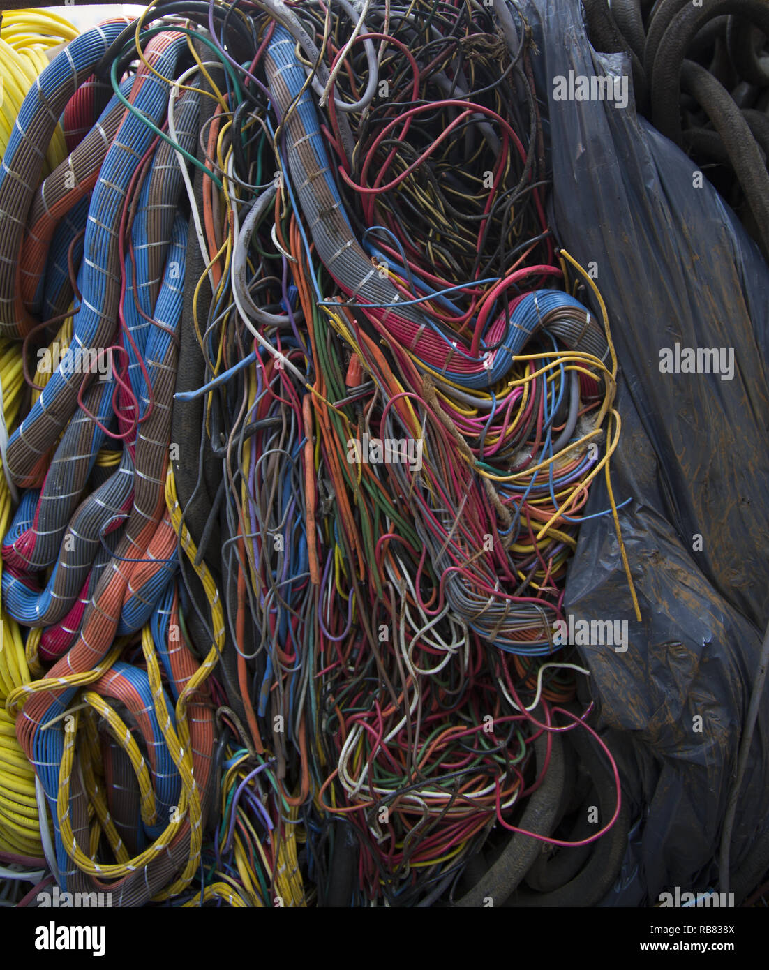 All sorts of electrical wiring and cables bunched together for