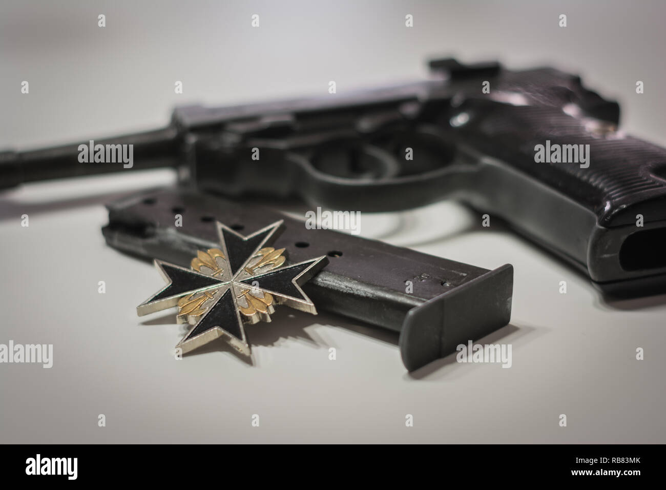 the nazi germany military automatic pistol with a magazine and iron cross. World war 2 weapon Stock Photo