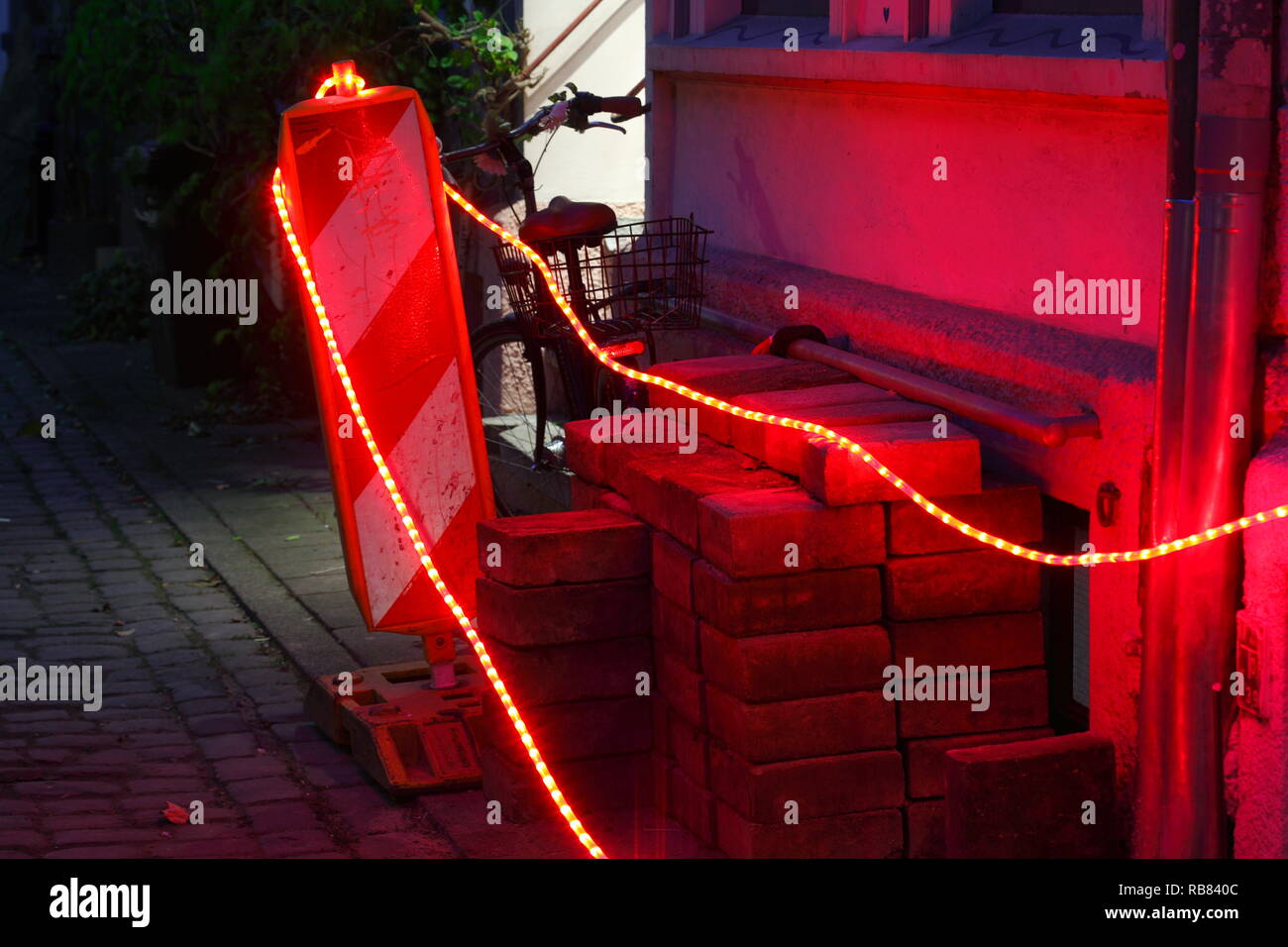 Flashing lights on a road barrier, construction site at dusk, Bremen, Germany, Europe Stock Photo