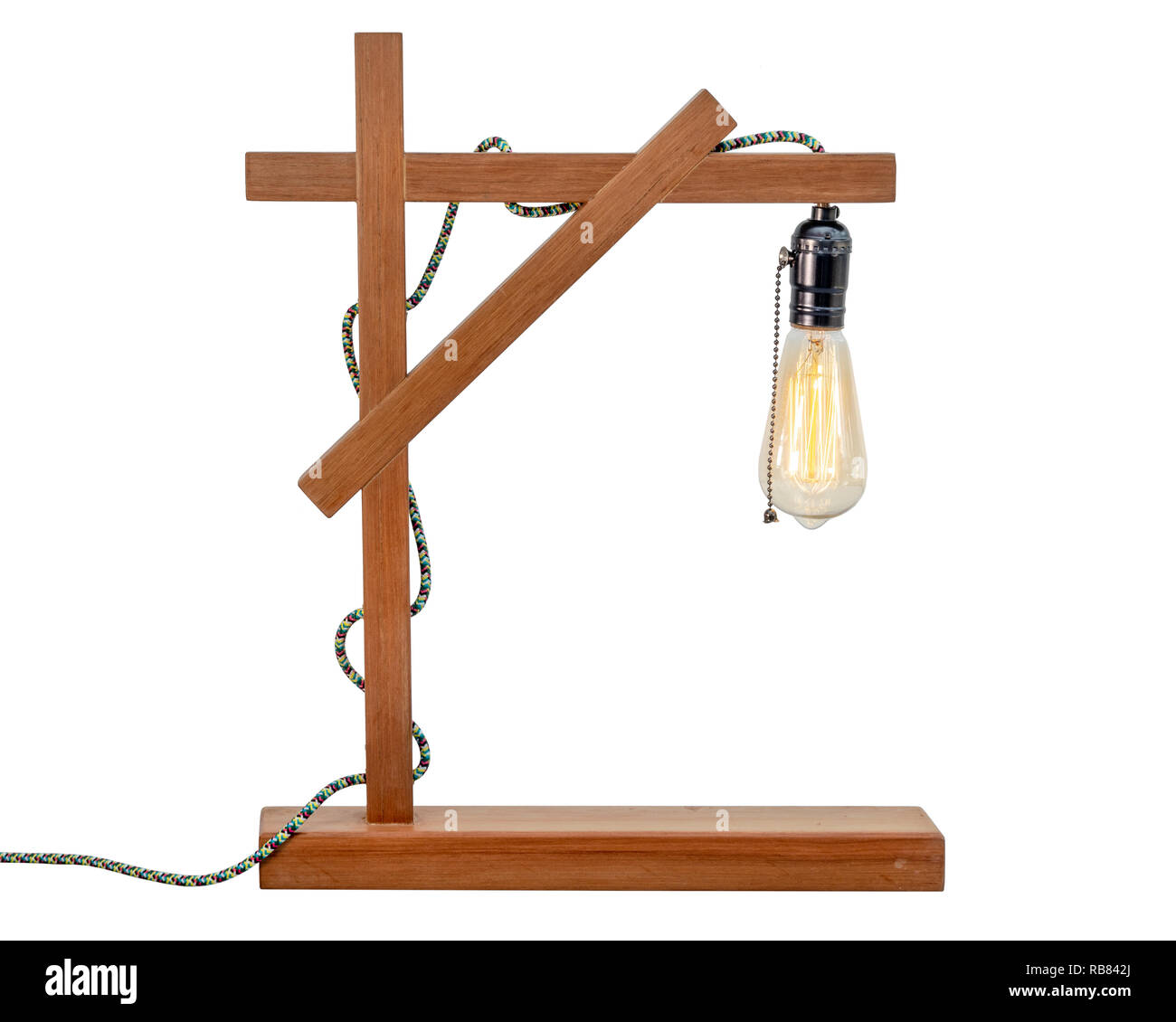 Rustic wood table lamp with small white lampshade isolated on white