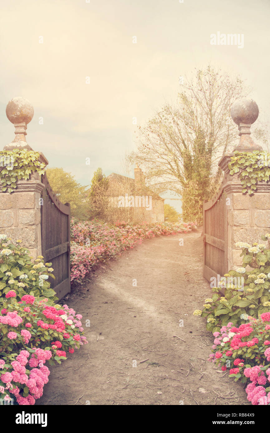 Fantasy garden with gates and flowers background Stock Photo