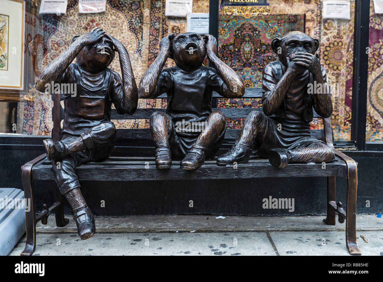 New York City, USA - July 25, 2018: Statue of Three wise monkeys, embodying the proverbial principle 'see no evil, hear no evil, speak no evil', on a  Stock Photo