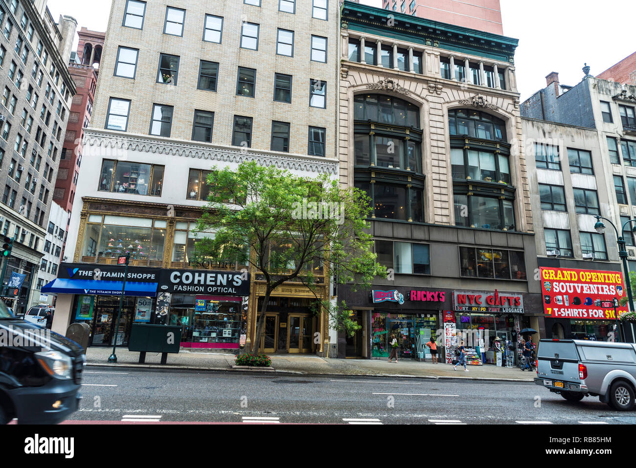 New York City, USA - July 25, 2018: Souvenir shops, traffic and people around in 5th Avenue in Manhattan in New York City, USA Stock Photo