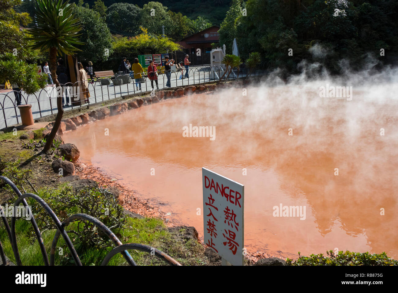 Beppu, Japan - November 2, 2018:  Chinoike Jigoku, Blood Pond Hell,  Red Volcanic Pool, a natural monument, on the hell tour in Beppu Stock Photo
