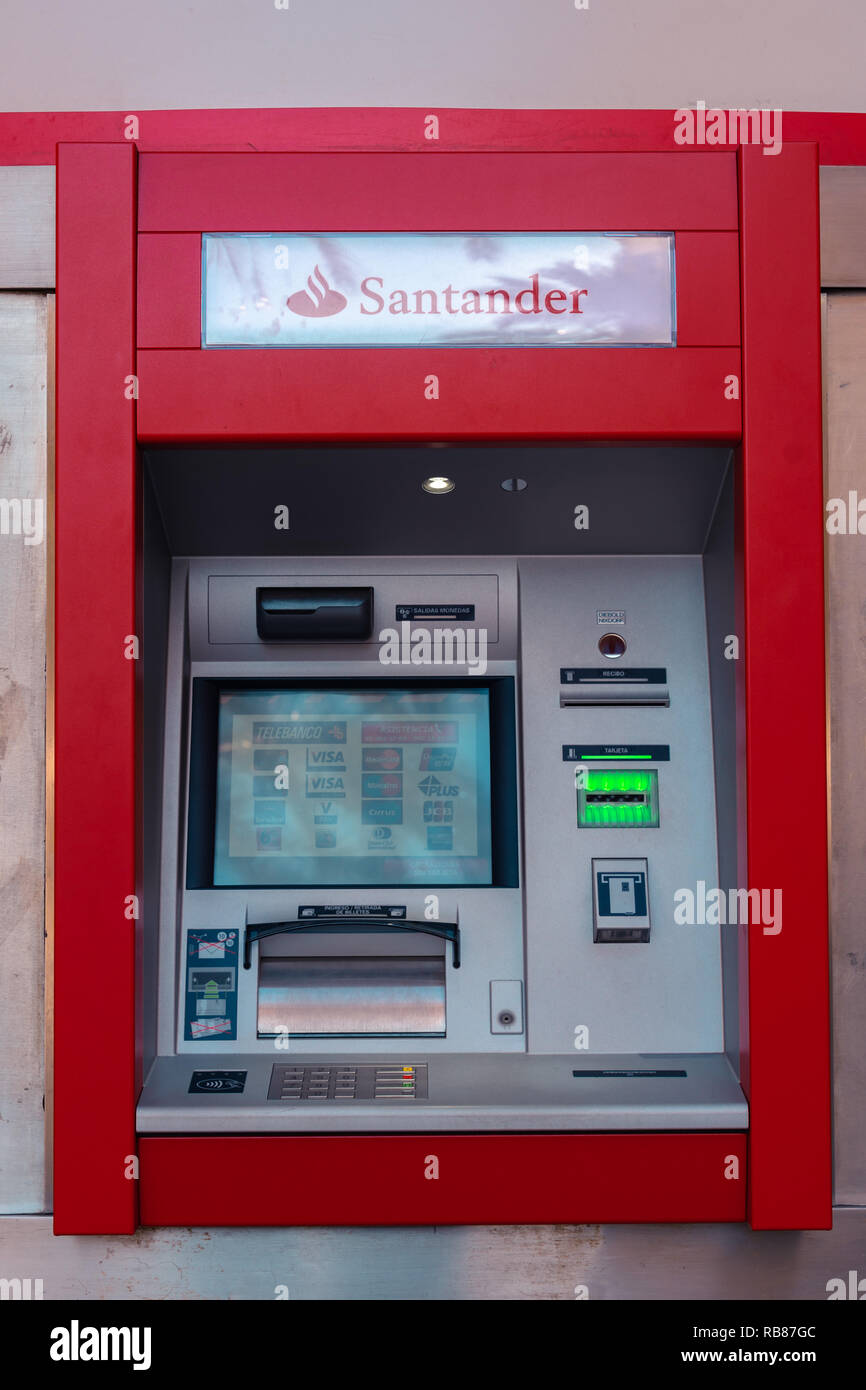 ATM terminal of Santander bank, one of the biggest Spanish banks. Valencia,  Spain. Visa, MasterCard, Maestro cards Stock Photo - Alamy
