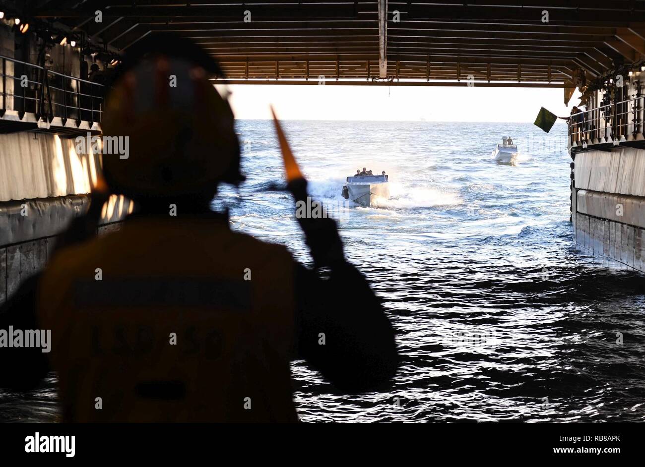 ATLANTIC OCEAN (Dec. 09, 2016) – Sailors aboard the amphibious dock landing ship USS Carter Hall (LSD 50) direct Special Warfare Combatant-craft Crewmen (SWCC) with Special Boat Team (SBT) 20 into the ship’s well deck. The team practiced mooring and maneuvering their craft inside the ship’s well deck. Carter Hall is underway with the Bataan Amphibious Readiness Group (ARG) participating in ARG/Marine Expeditionary Unit Exercise (ARG/MEUEX). Stock Photo
