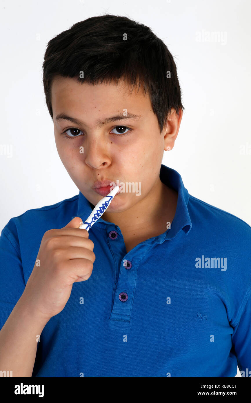 12-year-old boy brushing his teeth. Stock Photo