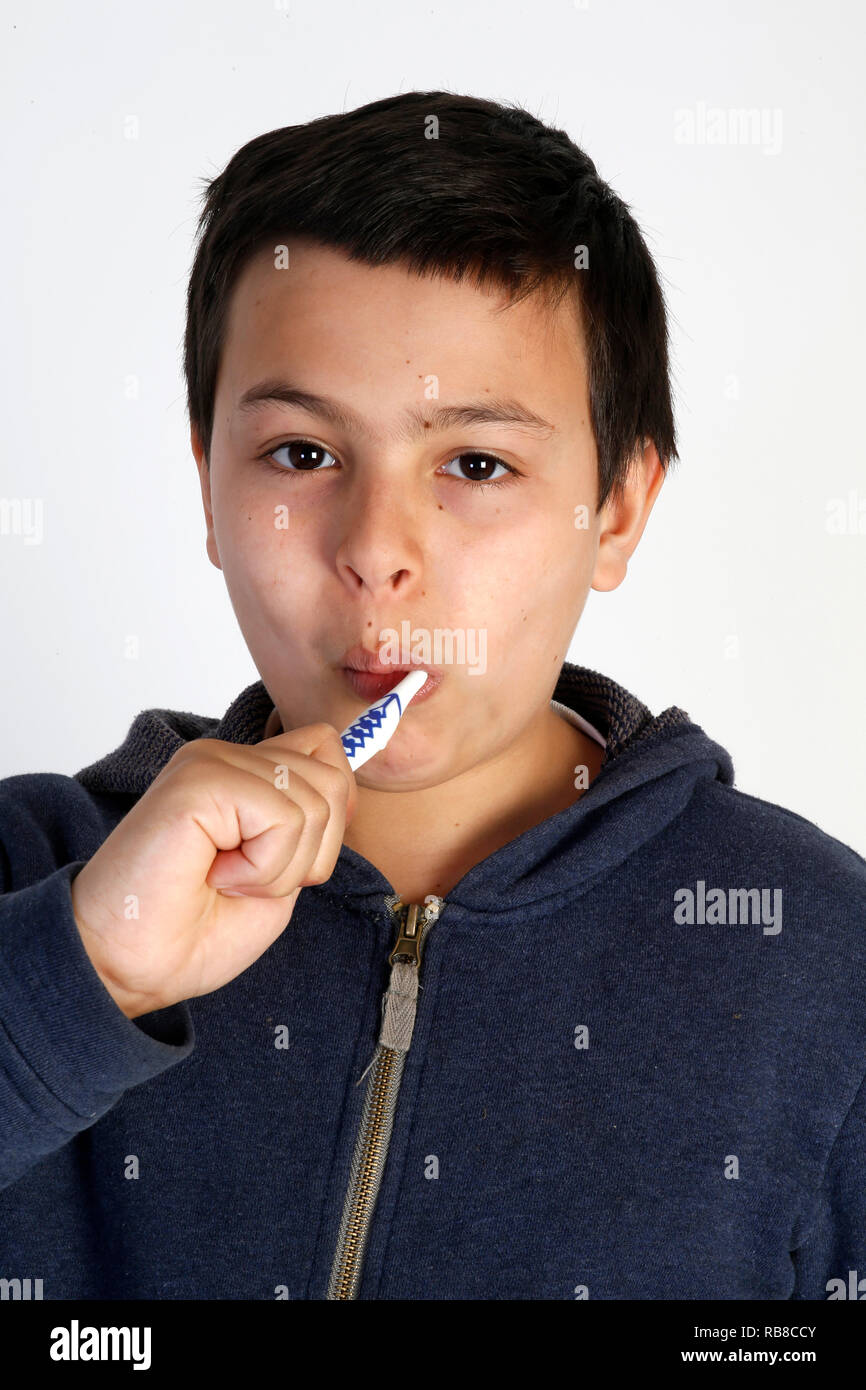 12-year-old boy brushing his teeth. Stock Photo