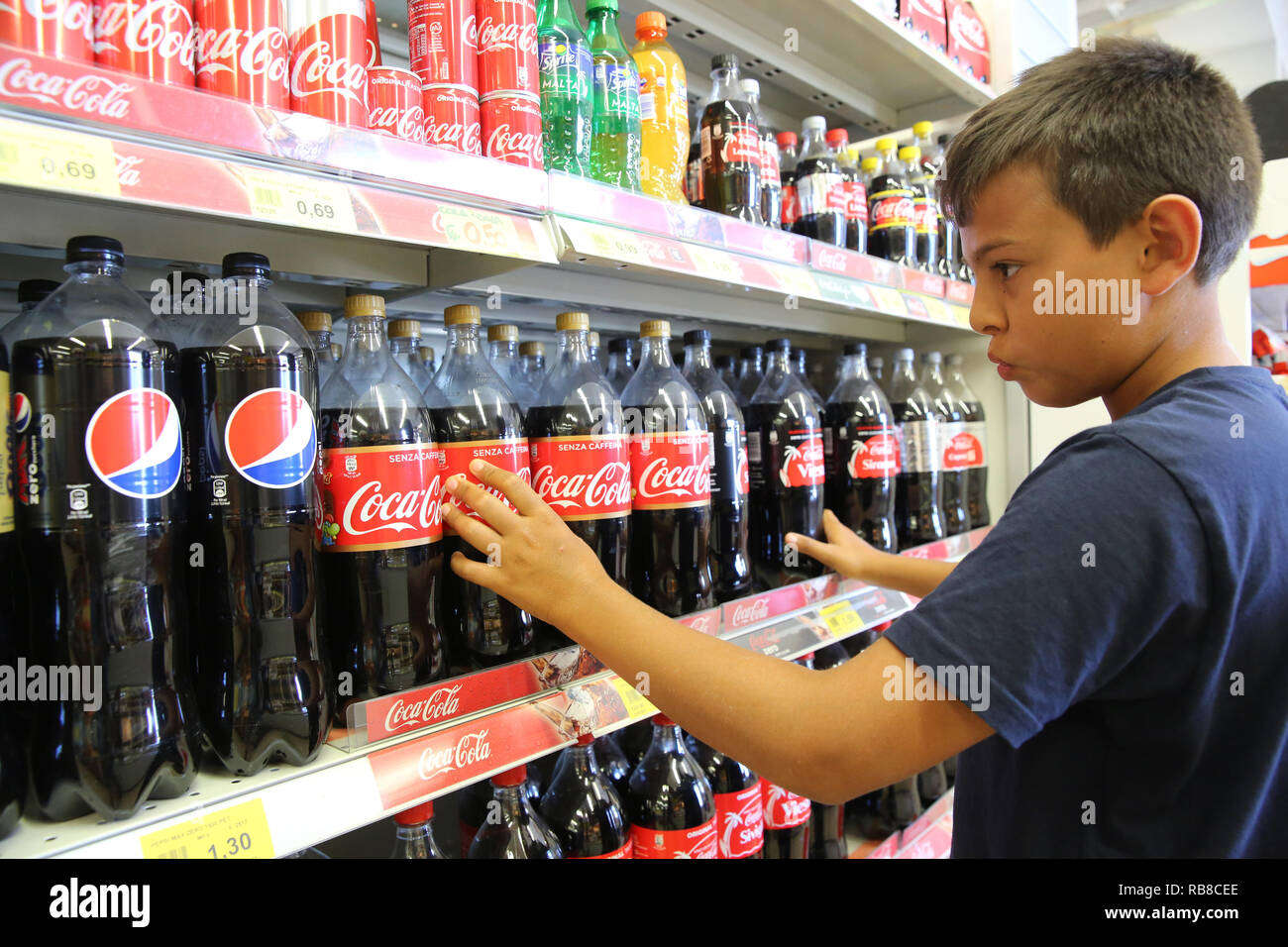 11 Year Old Boy Buying Soft Drinks In Salento Italy Stock Photo Alamy