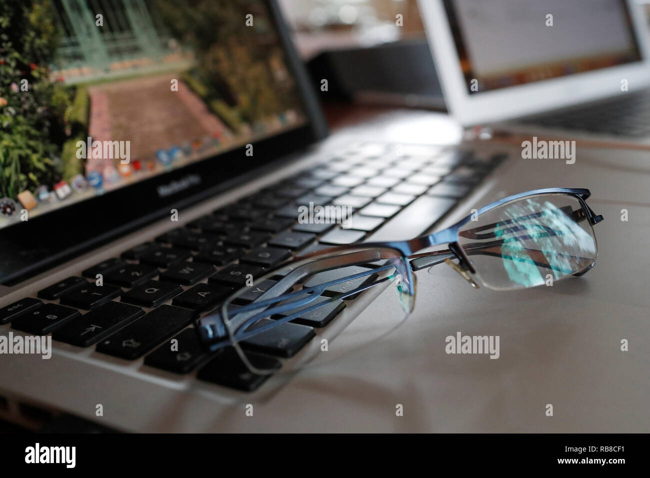 Mac Book Pro. Keyboard and glasses. Geneva. Switzerland. Stock Photo