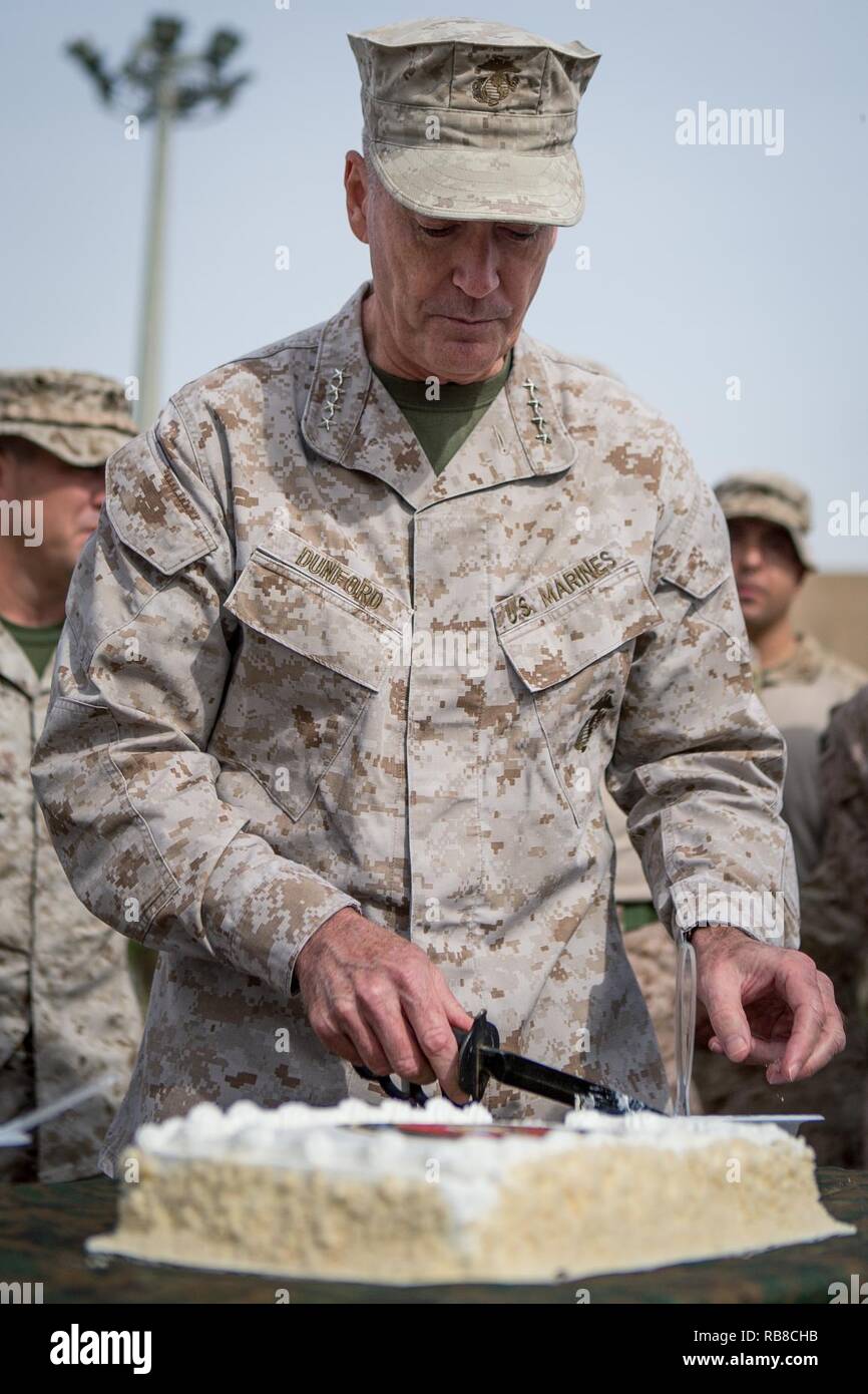 General Joseph Dunford Jr., Chairman of the Joint Chiefs of Staff, cuts a birthday cake during a ceremony in honor of the 241st Marine Corps Birthday with U.S. Marines from Weapons Company, 3rd Battalion, 7th Marine Regiment, Special Purpose Marine Air-Ground Task Force - Crisis Response - Central Command, in Erbil, Iraq, Nov. 10, 2016. SPMAGTF-CR-CC is forward deployed in several host nations, with the ability to respond to a variety of contingencies rapidly and effectively. Stock Photo