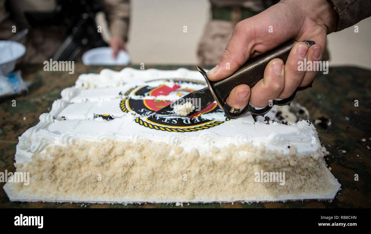 U.S. Marines from Weapons Company, 3rd Battalion, 7th Marine Regiment, Special Purpose Marine Air-Ground Task Force - Crisis Response - Central Command, hold a cake-cutting ceremony in honor of the 241st Marine Corps Birthday in Erbil, Iraq, Nov. 10, 2016. SPMAGTF-CR-CC is forward deployed in several host nations, with the ability to respond to a variety of contingencies rapidly and effectively. Stock Photo