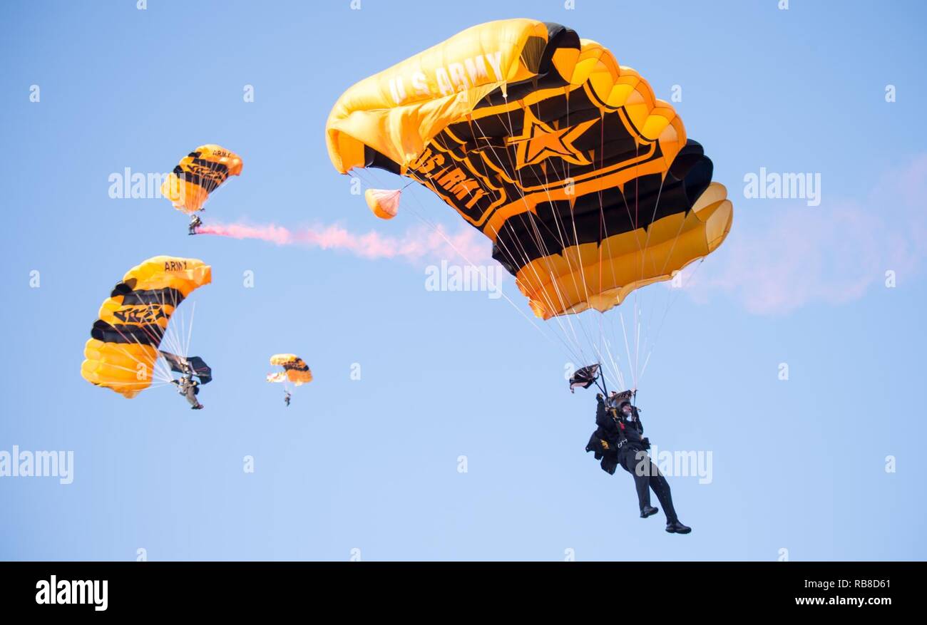 Members of the U.S. Army Parachute Team Golden Knights enter M&T Bank Stadium before the 2016 Army Navy Game in Baltimore, Md., Dec. 10, 2016.  The U.S. Military Academy cadets from West Point broke a 14-year Navy win streak after defeating the U.S. Naval Academy Midshipmen 21-17. Stock Photo