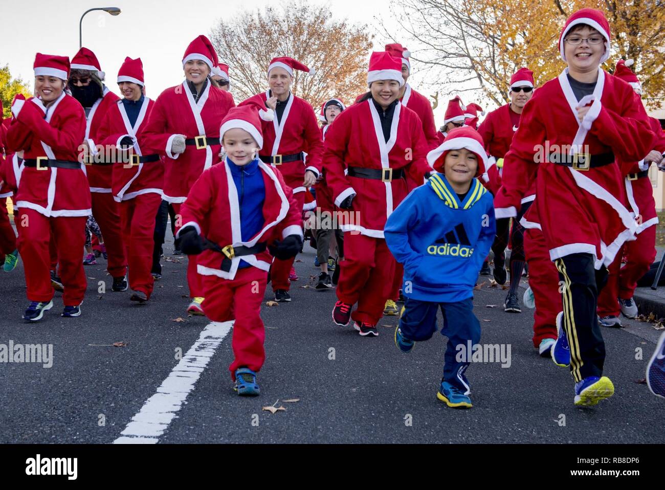 Participants Start Running During The Santa Shuffle 5k Fun Run Dec