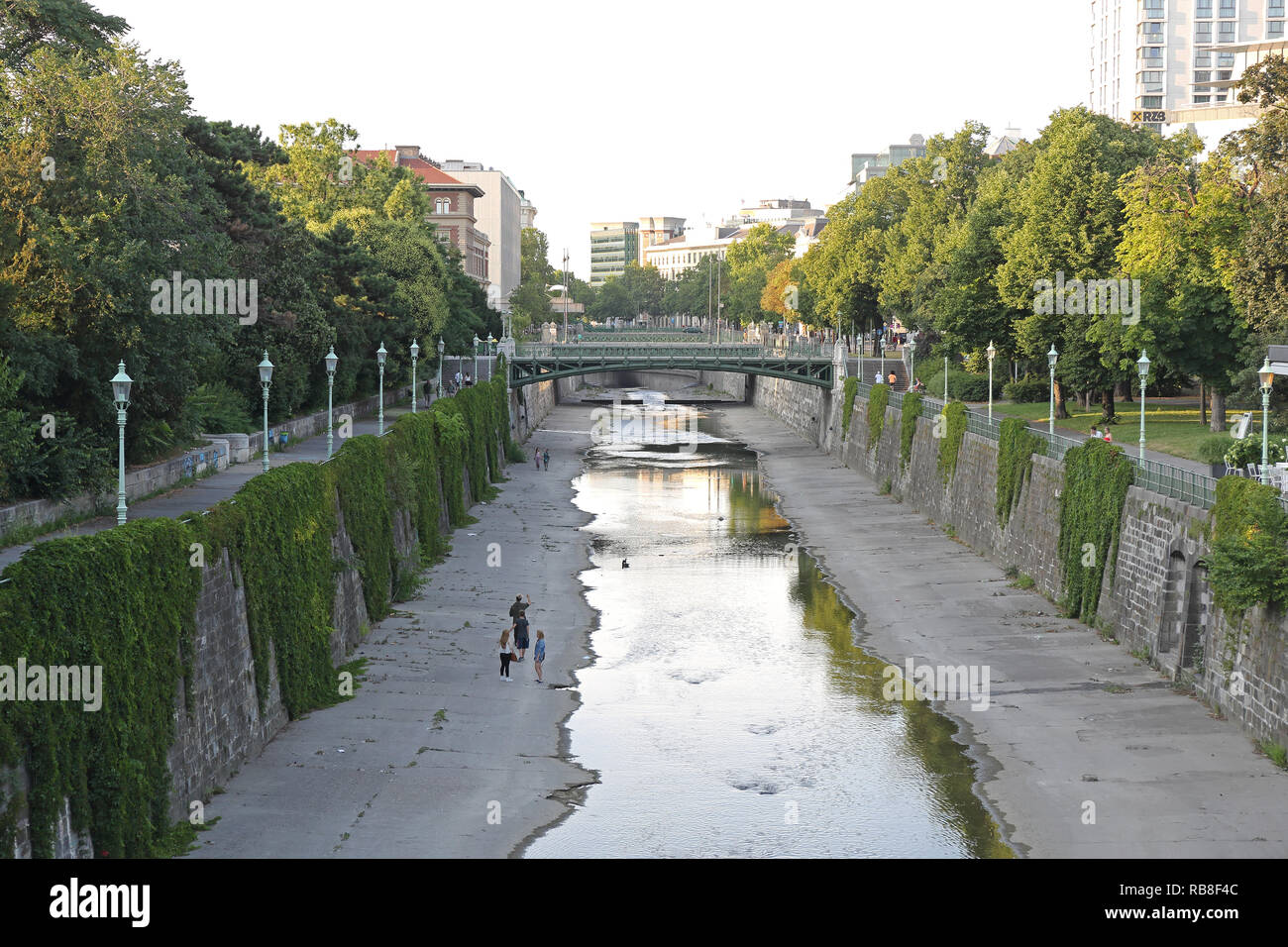 VIENNA, AUSTRIA - JULY 11, 2015: People Walking along Wien River at Stadtpark in Vienna, Austria. Stock Photo