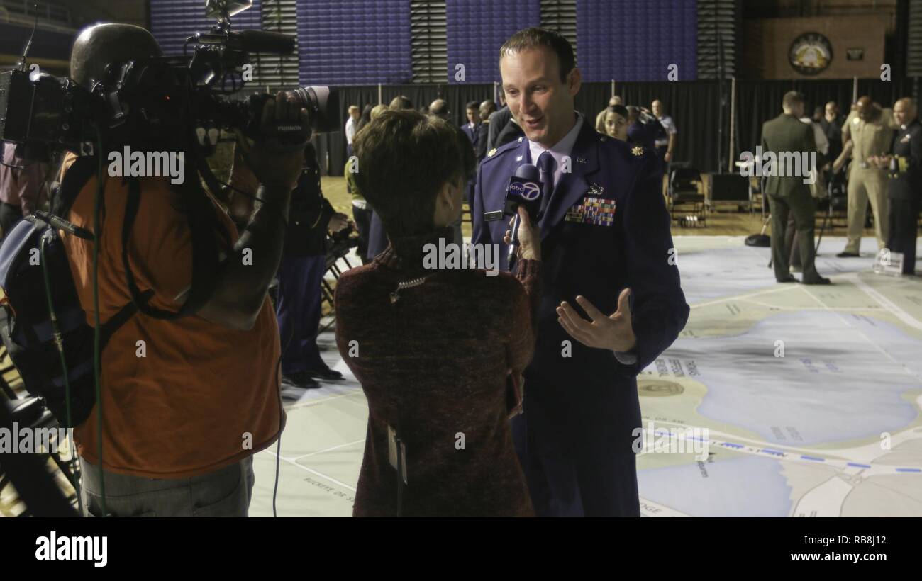 U.S. Air Force Maj. Michael Odle, public affairs officer, Joint Task Force D.C. National Guard, speaks with the media during the interview portion of the ceremonial rehearsal of concept drill at the D.C. National Guard Armory in Washington Dec. 14, 2016. This final planning symposium showcased the culmination of months of preparation between military and civilian entities for the 58th Presidential Inauguration. Stock Photo