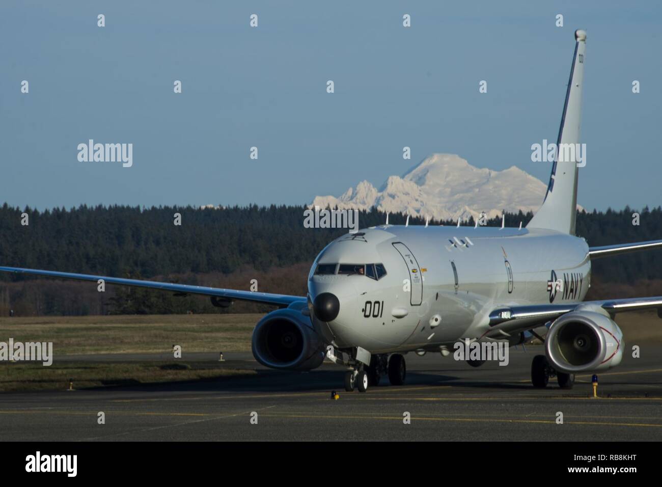 OAK HARBOR, Wash. (Dec. 16, 2016) A P-8A Poseidon piloted by Lt.j.g. Giancarlo Palazzo of Patrol Squadron (VP) 4’s Skinny Dragons taxis on Naval Air Station (NAS) Whidbey Island’s Ault Field after completing a training exercise in eastern Washington. VP-4 is in the final stage of phase one in their transition from the P-3 Orion, in naval service since the 1960’s, to the P-8A Poseidon. Stage two of the transition will take place in Jacksonville, FL through the training of Sailors from Patrol Squadron (VP) 30. Stock Photo