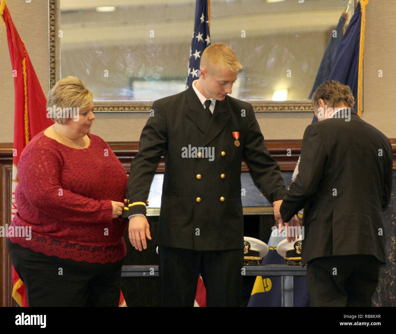 Remove tape from his ensign rank sleeve stripes hires stock