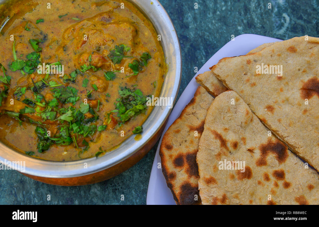 Indian curry with Roti bread on table for lunch in local restaurant ...
