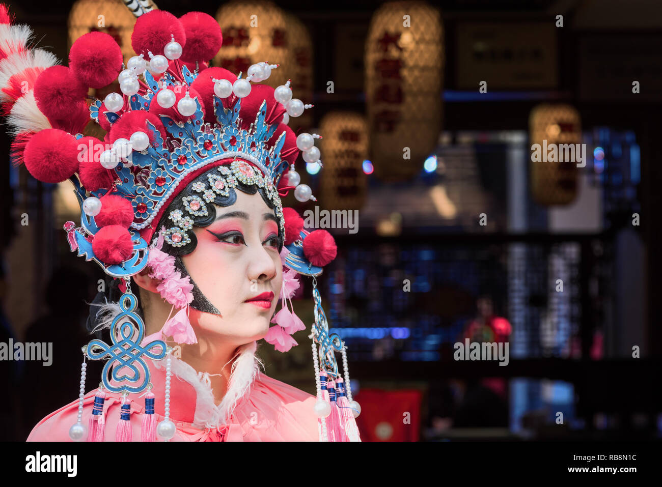 Chengdu, Sichuan Province, China - Nov 18, 2018 : Portrait of a yound woman dressed in Sichuan Opera traditional costume in Jinli street touristic area. Stock Photo