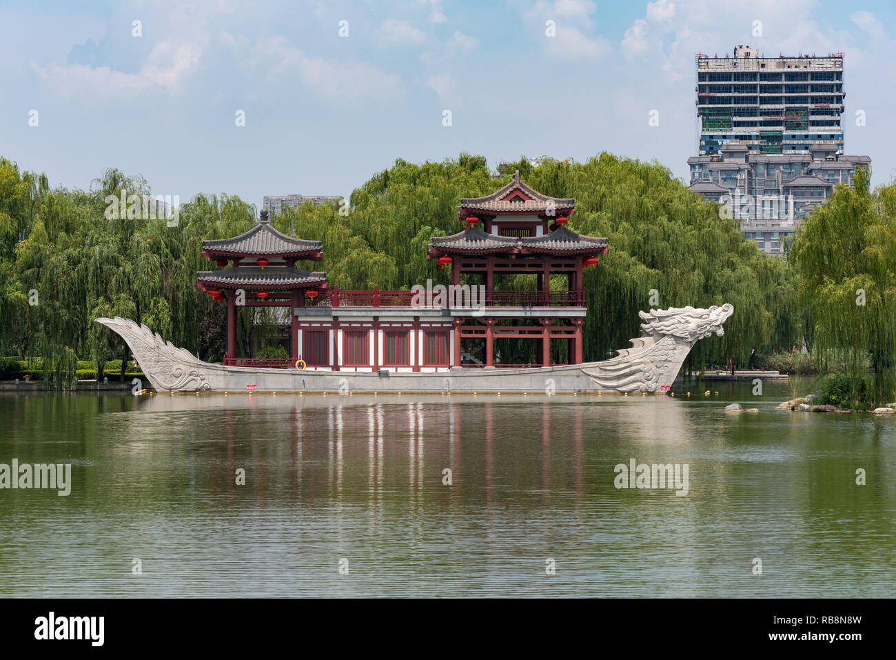 Xi'an, Shaanxi province, China - Aug 12, 2018 : Pagoda on a stone boat with dragon sculptures in Tang paradise park. Stock Photo