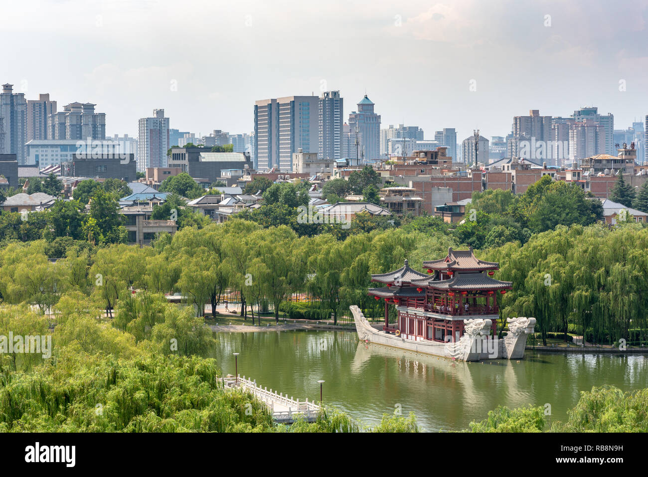Xi'an, Shaanxi province, China - Aug 12, 2018 : Pagoda on a stone boat with dragon sculptures aerial view in Tang paradise park. Stock Photo