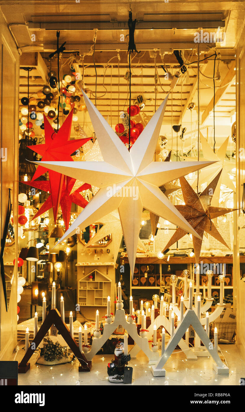 Christmas stars and candles decorations in window. Festive decor in the  shop window .Stockholm, Sweden Stock Photo - Alamy