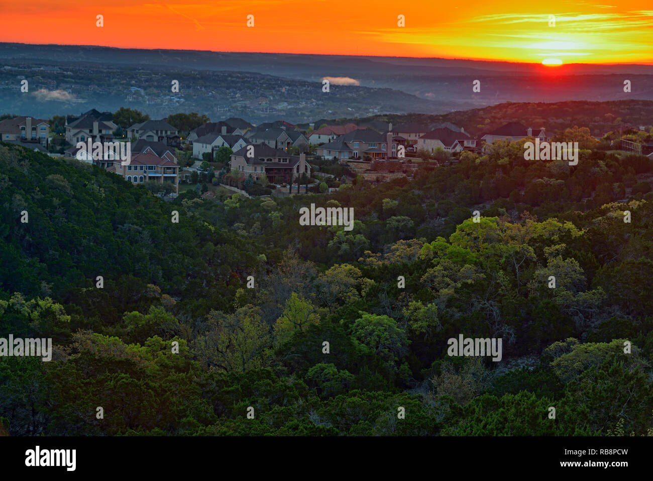Overlooking Hill Country bedroom communities at sunrise, Austin, Texas, USA Stock Photo