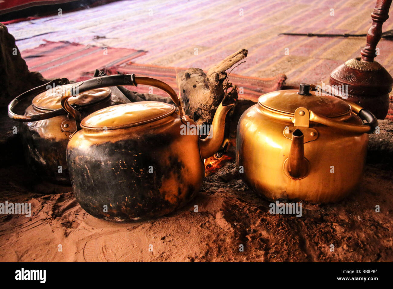 Traditional way of cooking Bedouin tea on an open fire in a desert Wadi Rum, Jordan Stock Photo