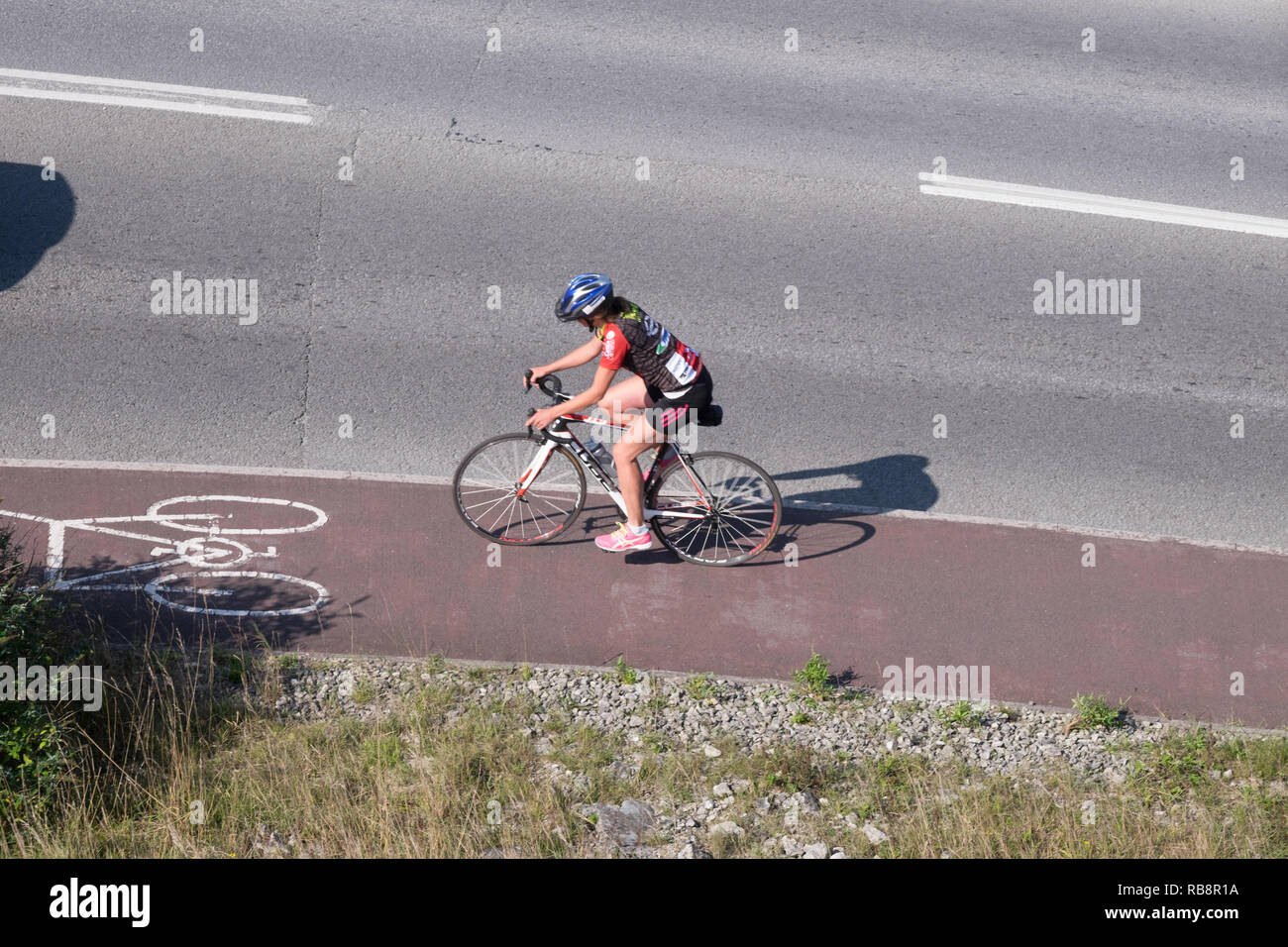Cyclist in cycle lane shot from above Stock Photo