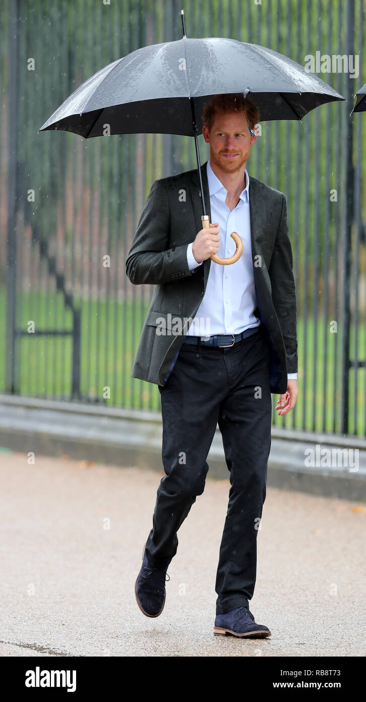 Prince Harry arrives to view tributes attached to the Golden Gates of Kensington Palace, left to his late mother Diana, Princess of Wales. Stock Photo