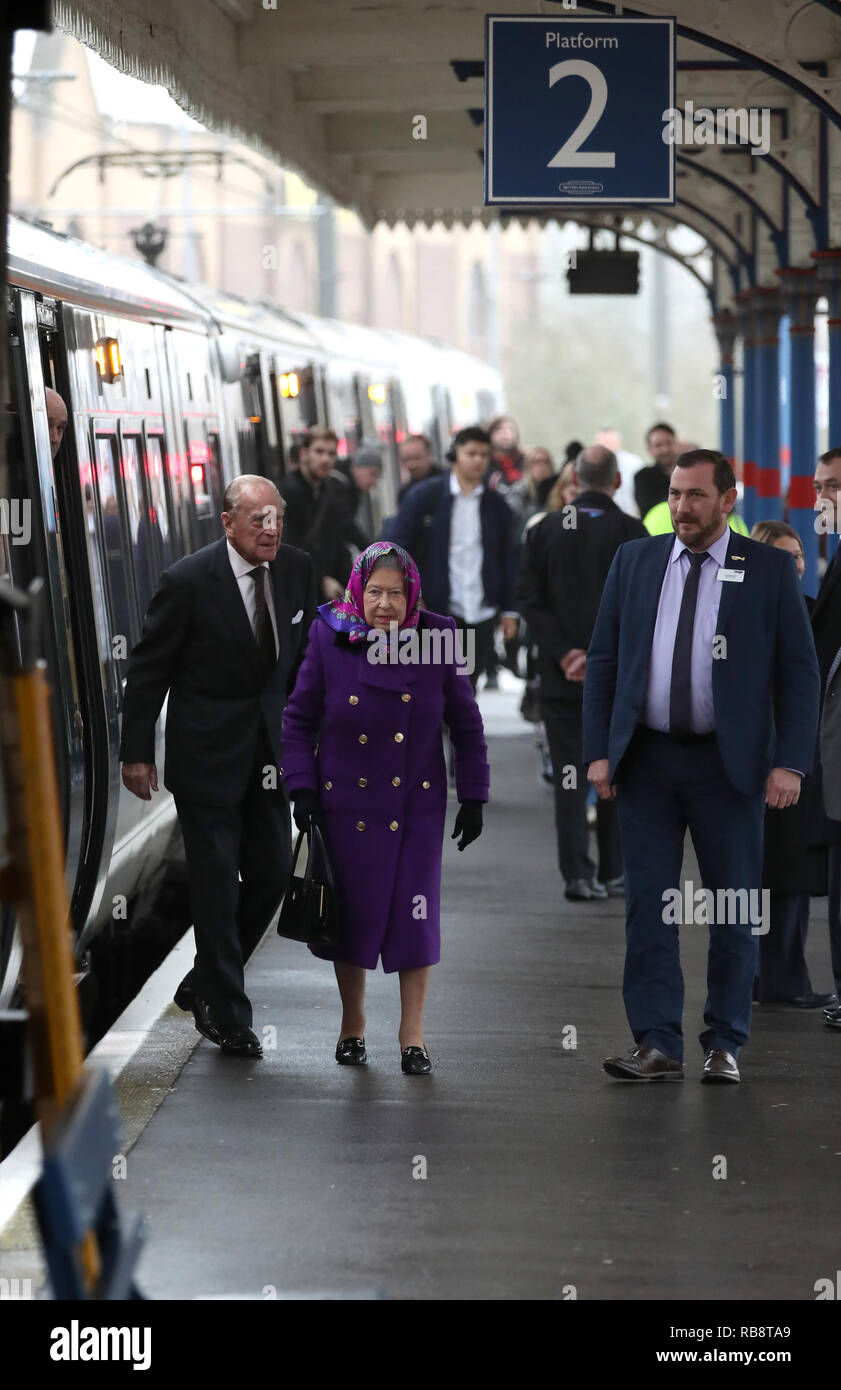 Britain's Queen Elizabeth II and The Duke of Edinburgh arrive at Kings Lynn Railway station as they arrive in Norfolk for their Christmas break on the Stock Photo